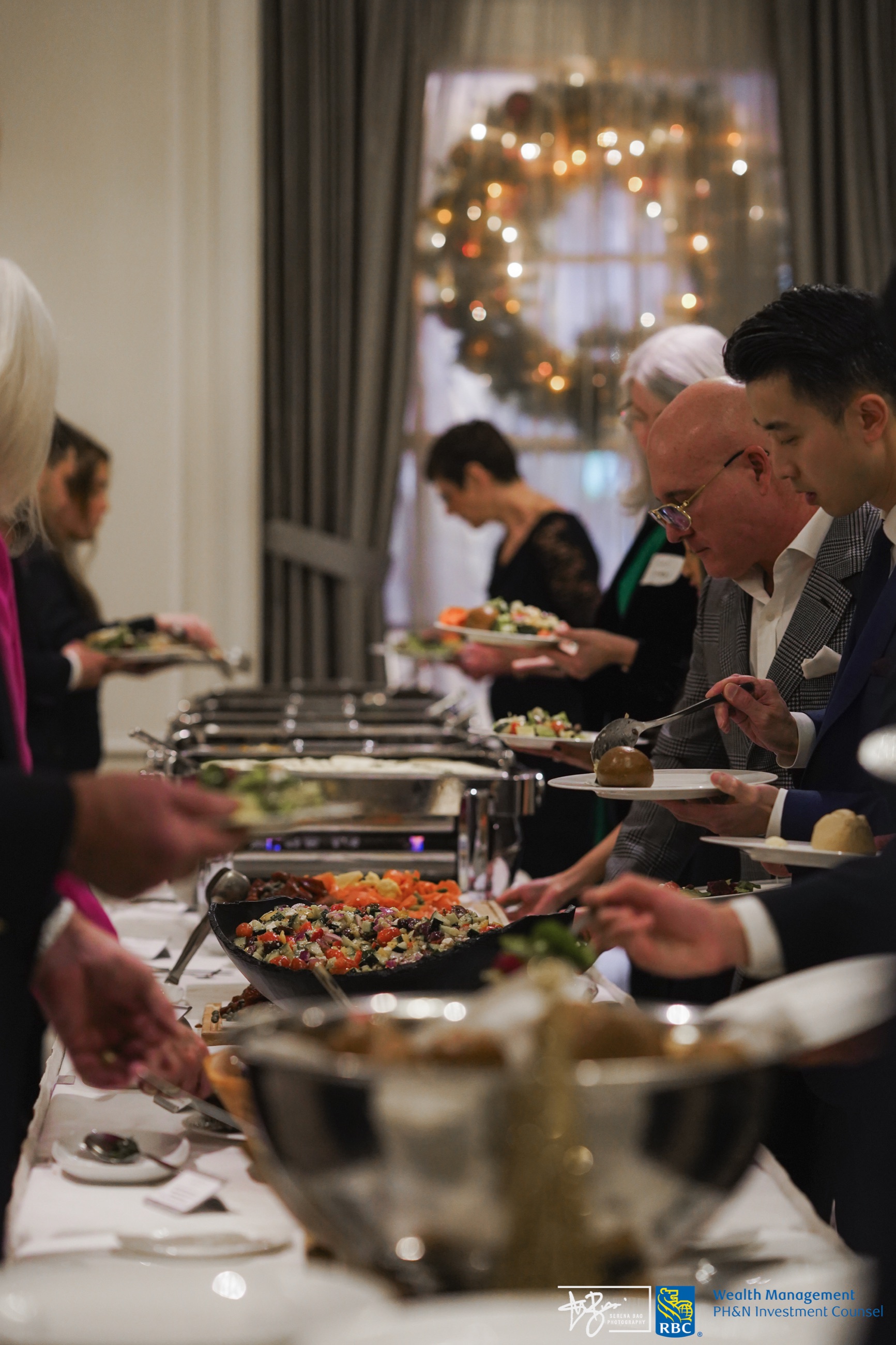 Guests enjoying the buffet at an evening event