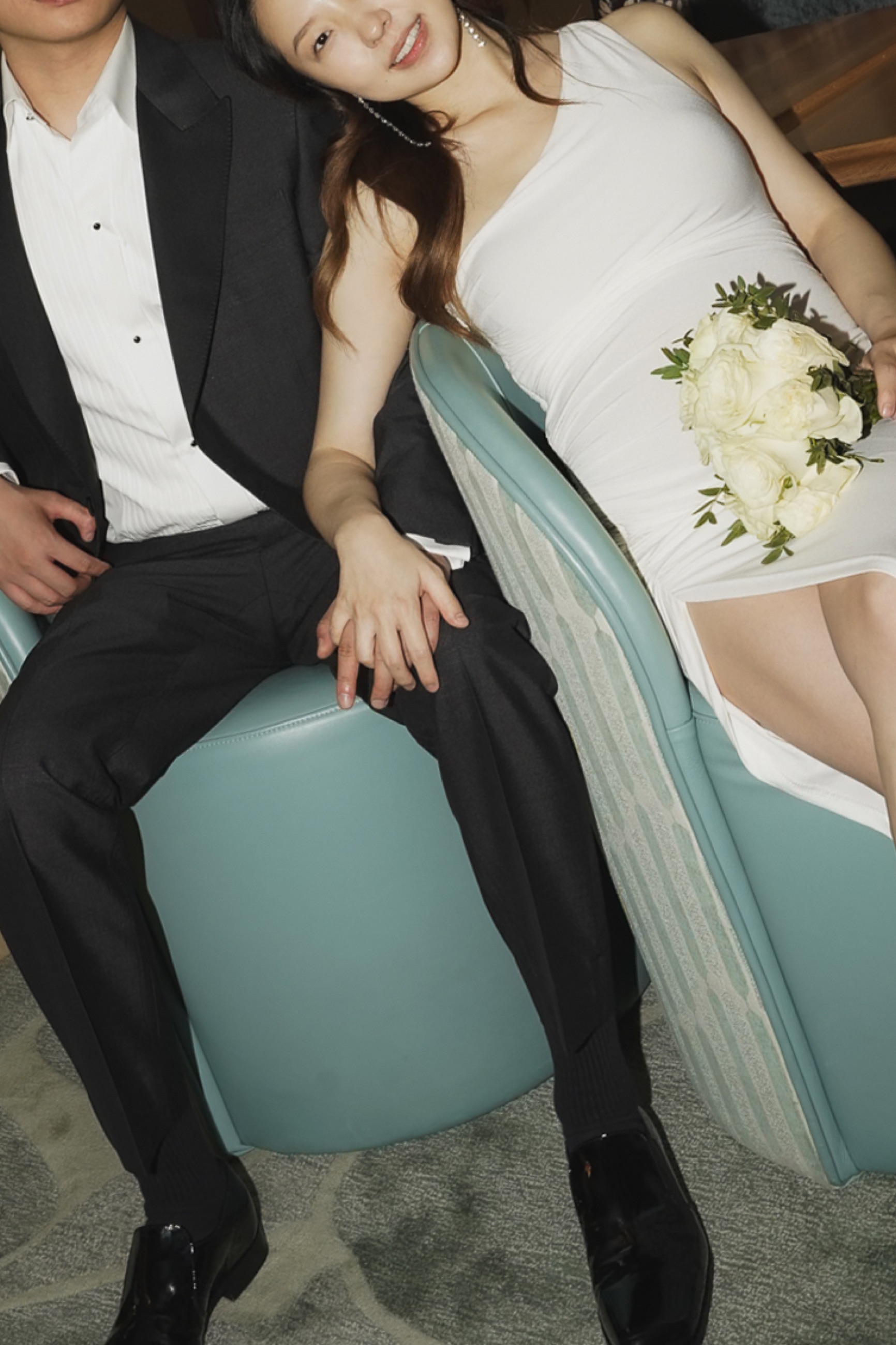 The elopement couple seated together in a quiet candid moment
