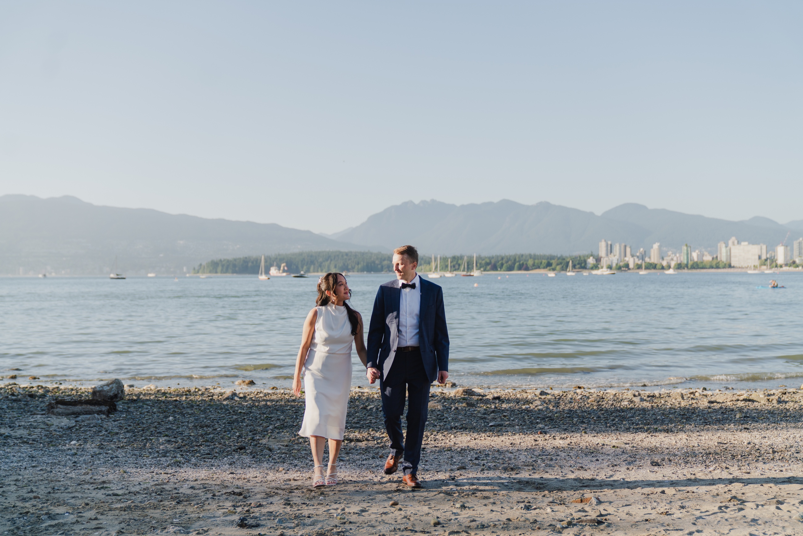 Newlyweds walking together along the Vancouver waterfront