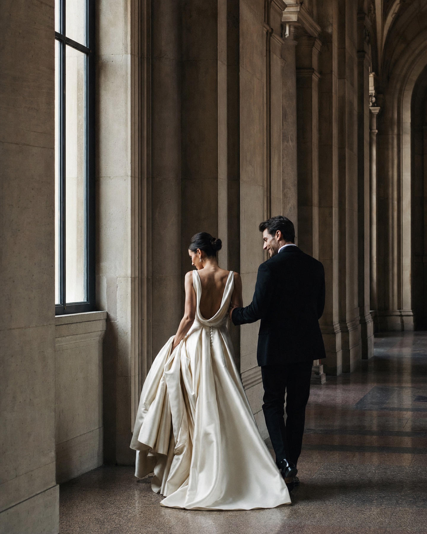 Couple in formal attire in a historic interior