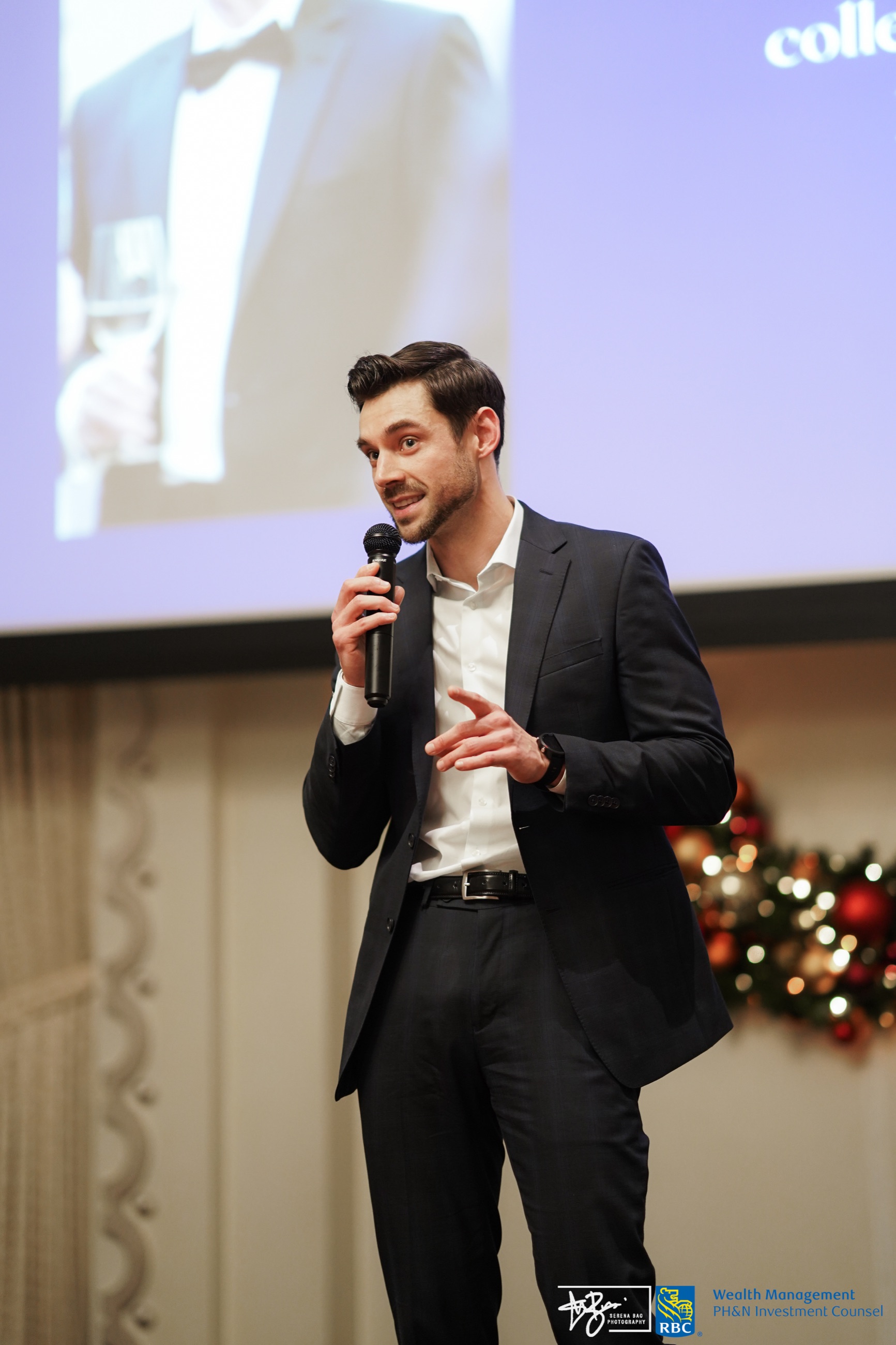 A speaker addressing guests at the Christmas dinner